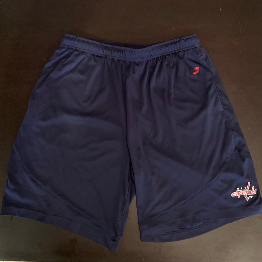 Men's large athletic shorts with Washington Capitals logo.